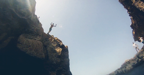 Person diving into a body of water GIF