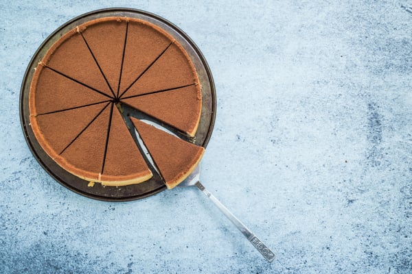 Sliced chocolate pie with piece on serving utensil