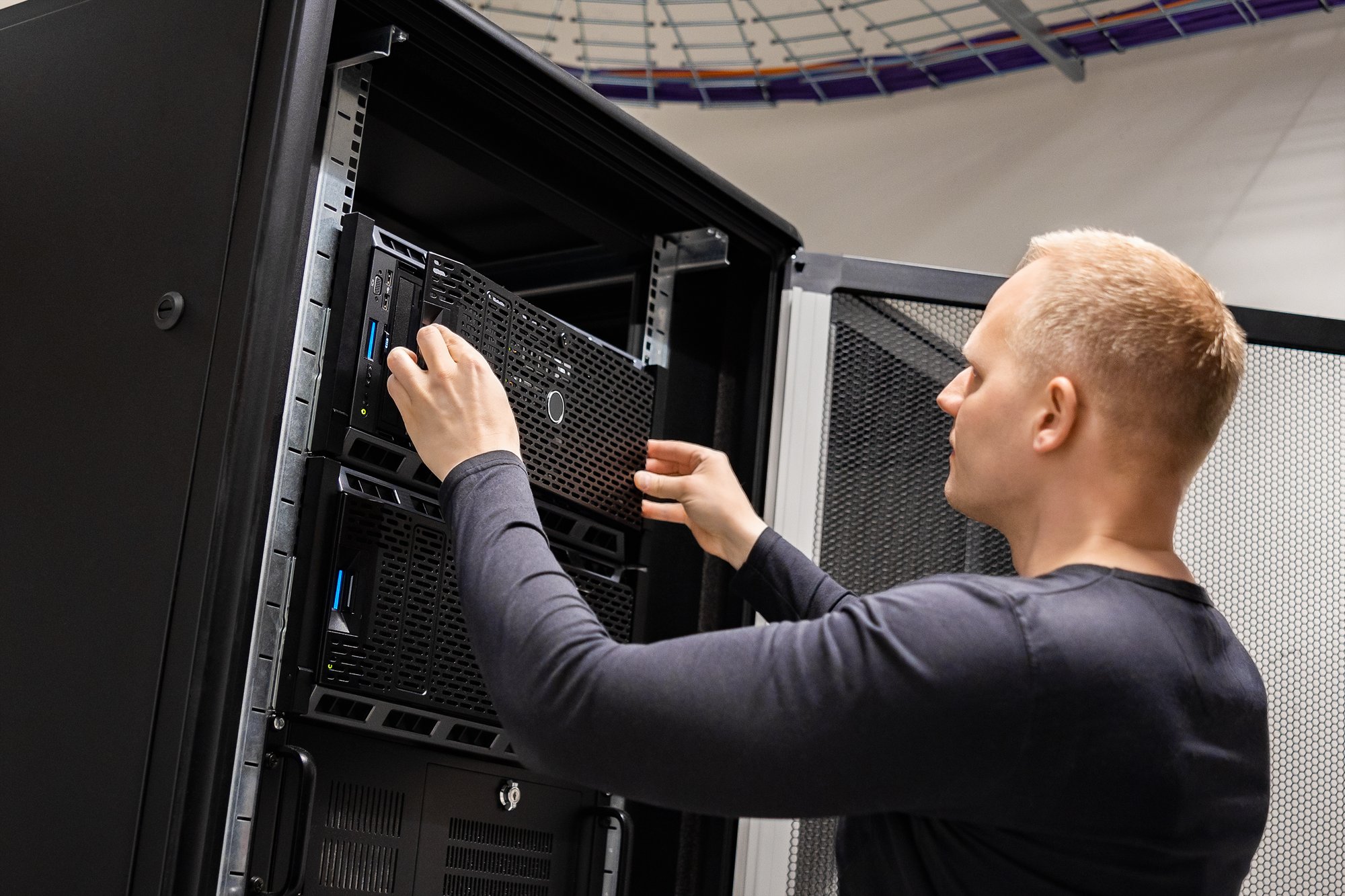 it-engineer-working-with-servers-in-datacenter-2023-11-27-04-58-31-utc